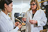 Scientists Holding Ring in Hand Image